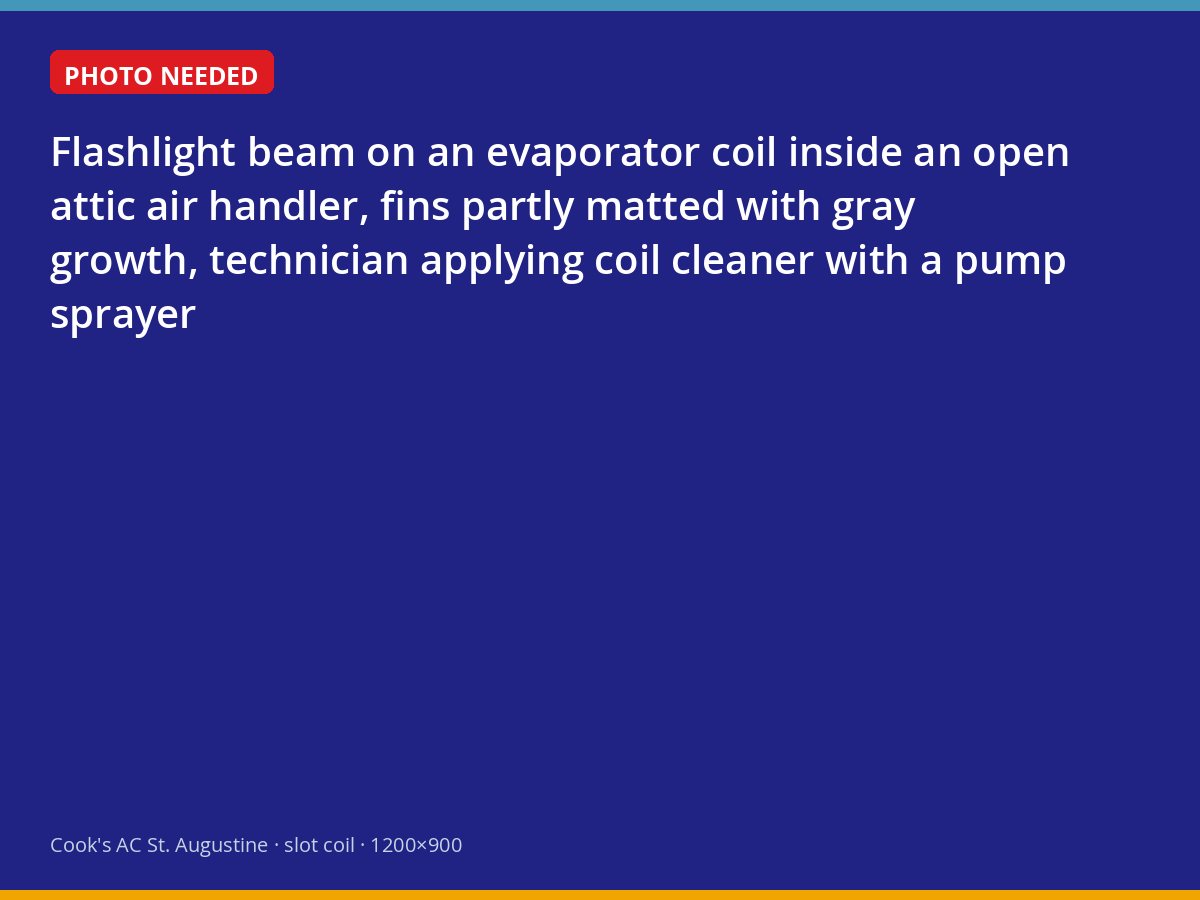 Technician cleaning a matted evaporator coil in a St. Augustine attic air handler